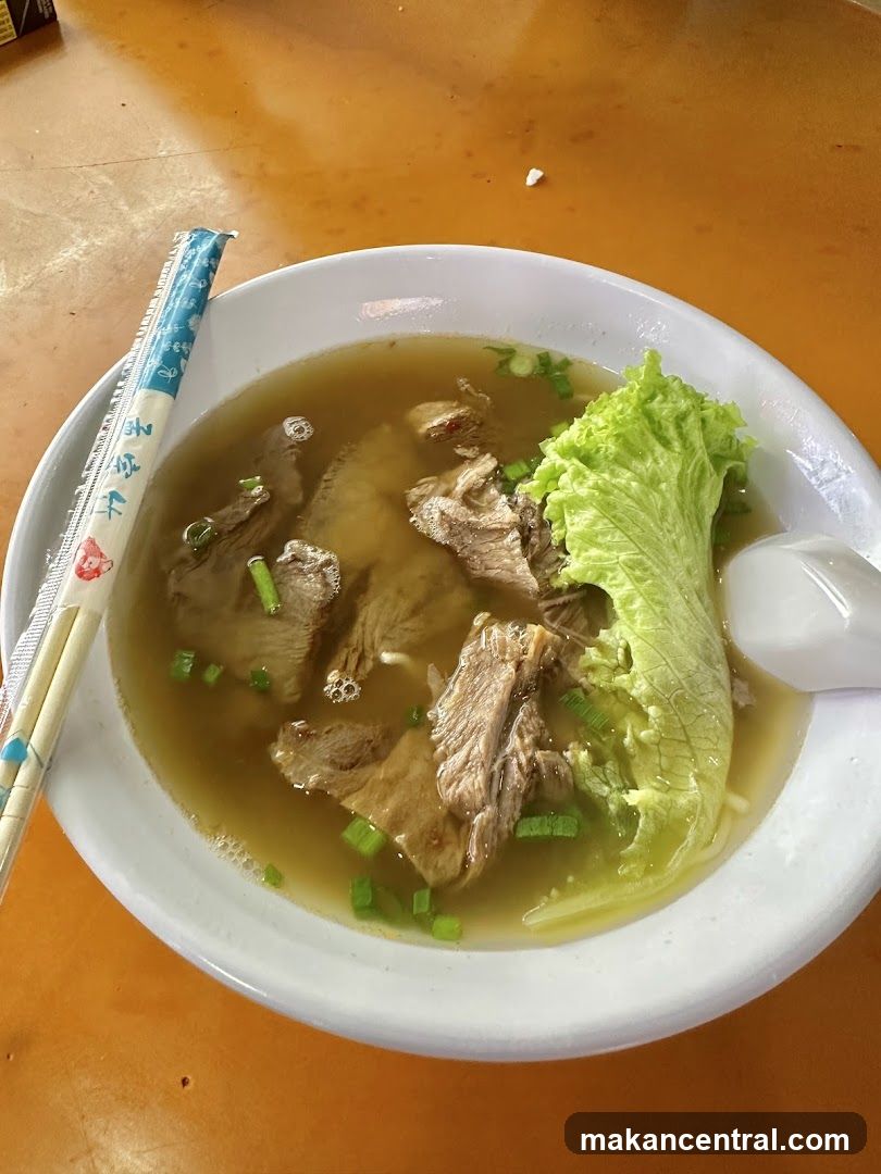 Bowl of Soup with Chopsticks