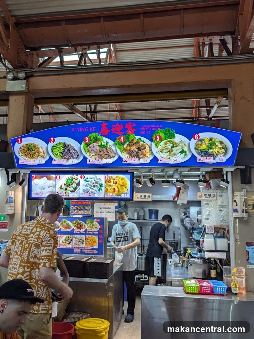 Food stall interior with staff and customers