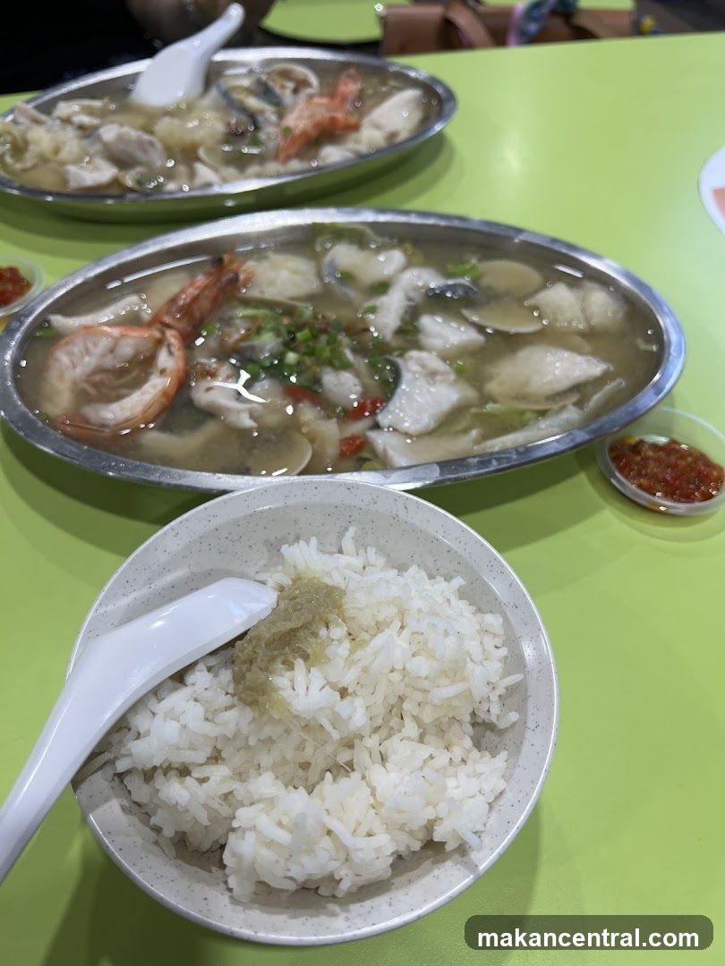 Dining Table with Seafood Soup and Rice
