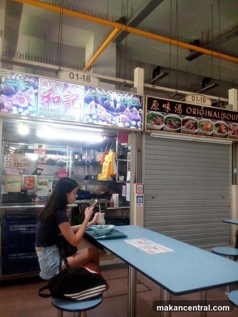 Food stall interior with customer seated at table
