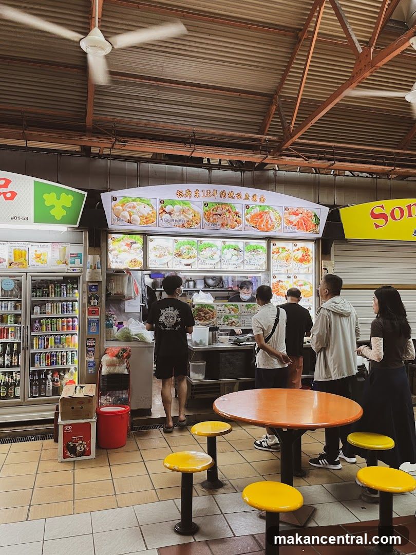 Food stall interior with customers and seating