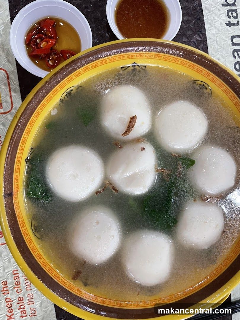 Food dish with soup and condiments