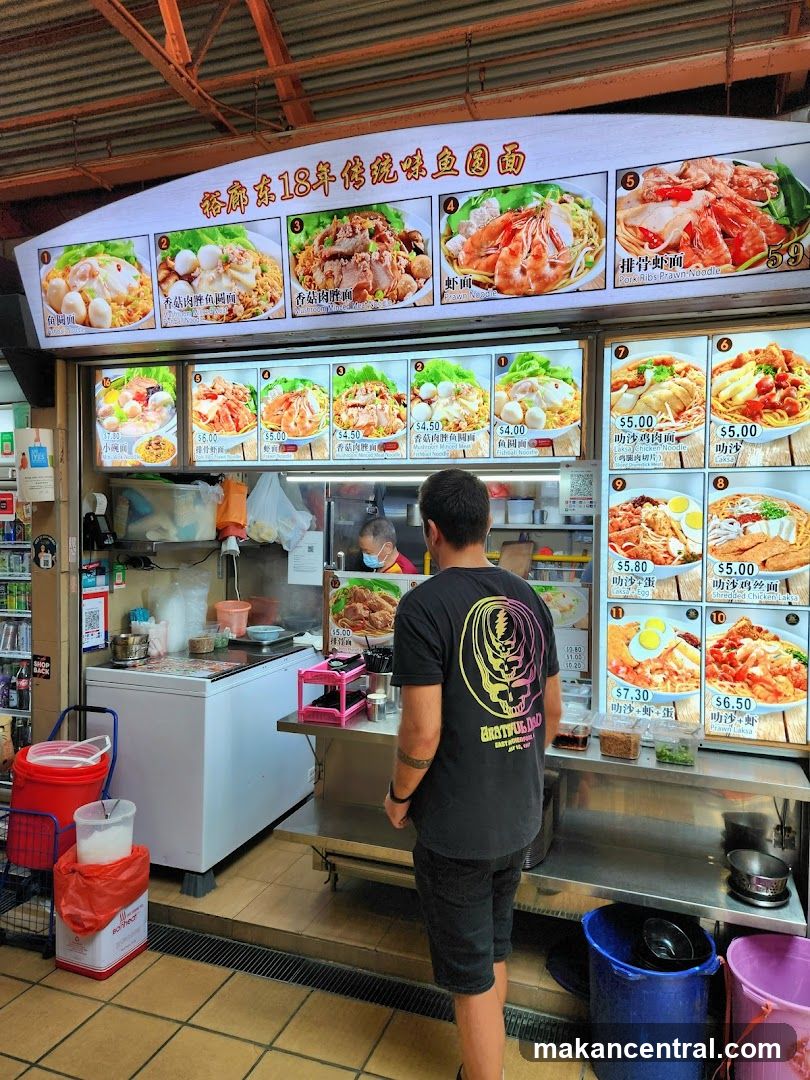 Food stall interior with customer and staff