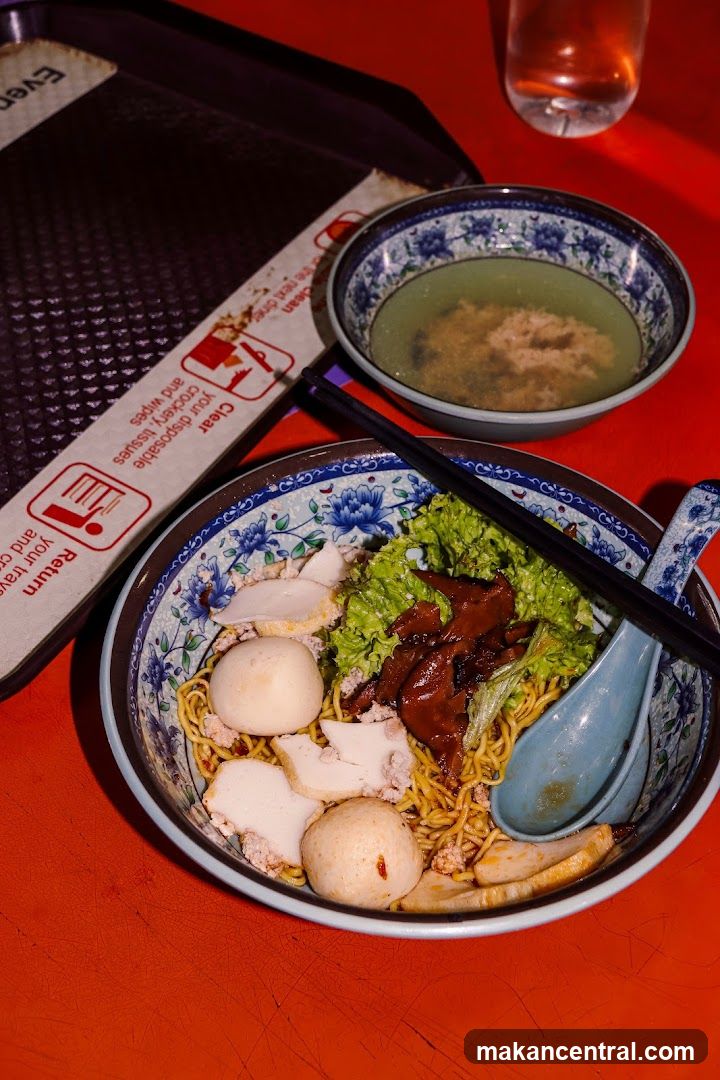 Noodle Bowl with Side Dish on Red Table