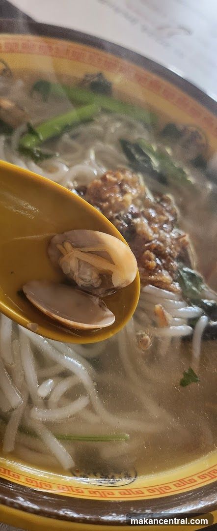 Close-up of noodle soup with clams