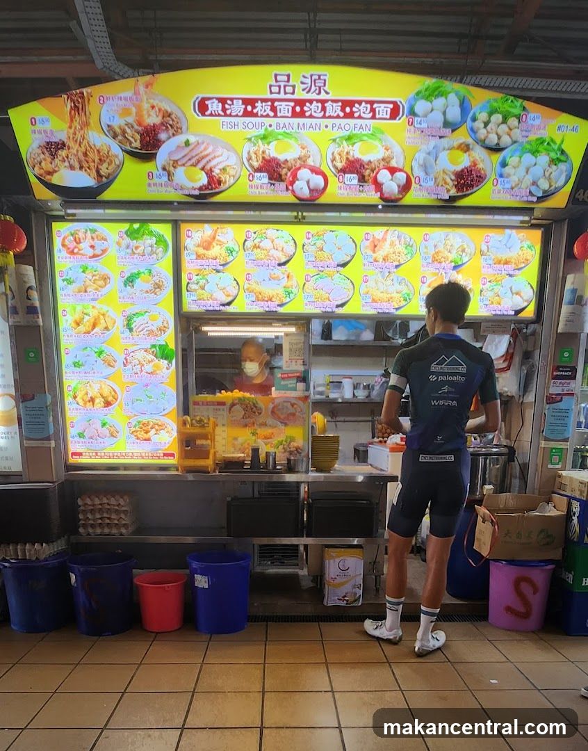 Food stall interior with customer and staff