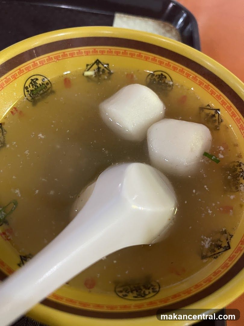 Soup in bowl with spoon