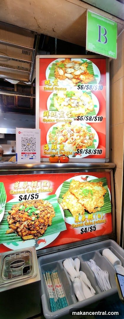 Food stall display with menu board and utensils