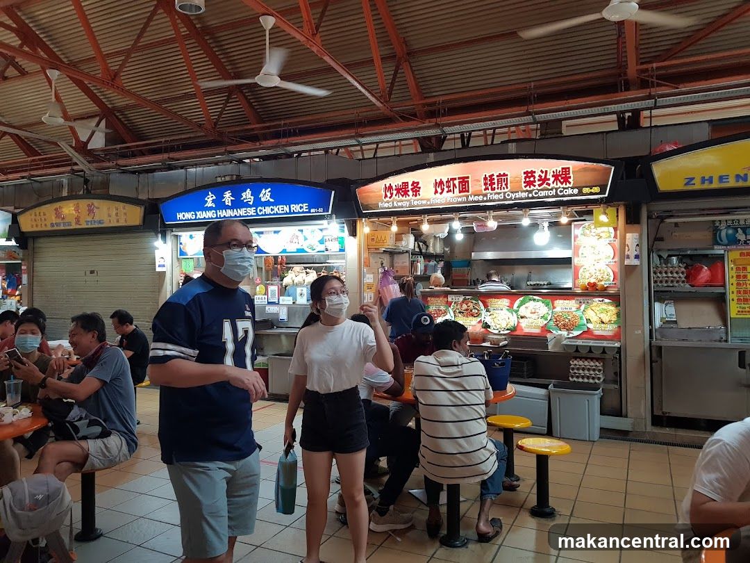 Food court interior with diners and stalls