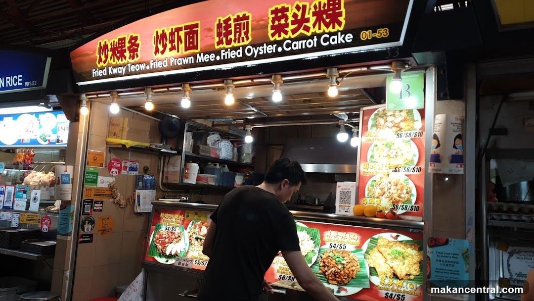 Food stall interior with staff preparing food