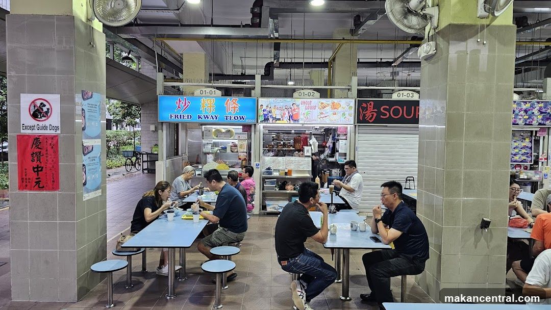 Food court interior with diners and stalls