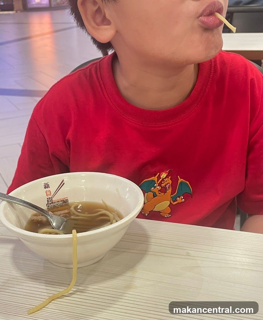 Child Eating Noodles
