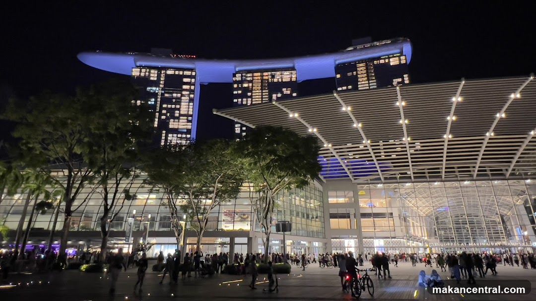 Nighttime view of Marina Bay Sands and adjacent plaza