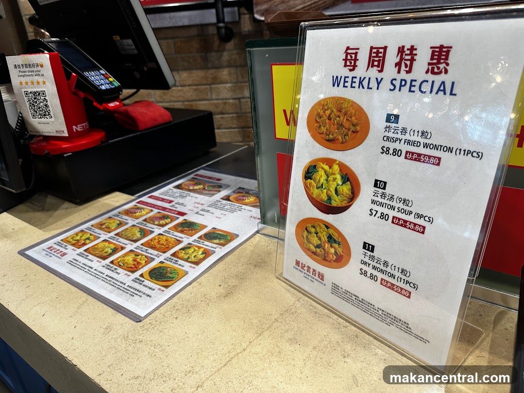 Restaurant counter with weekly special sign and payment terminal