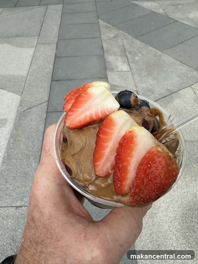 Hand holding fruit dessert