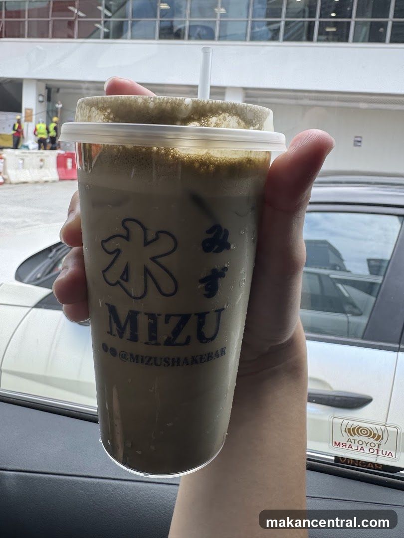 Hand holding drink from Mizu Shakebar