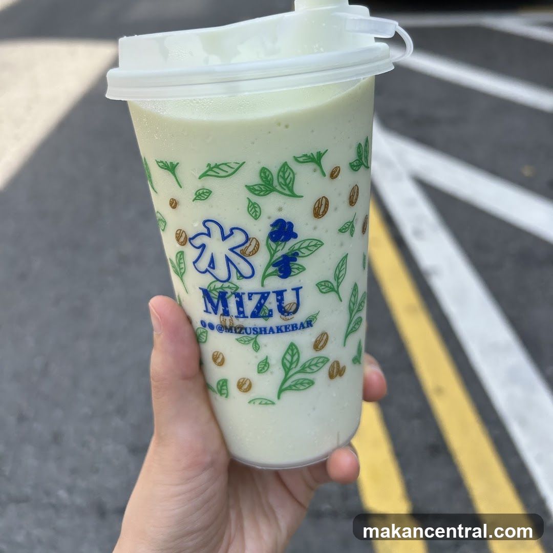 Hand holding a drink cup