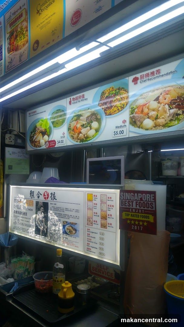 Food stall interior with signage and promotional materials