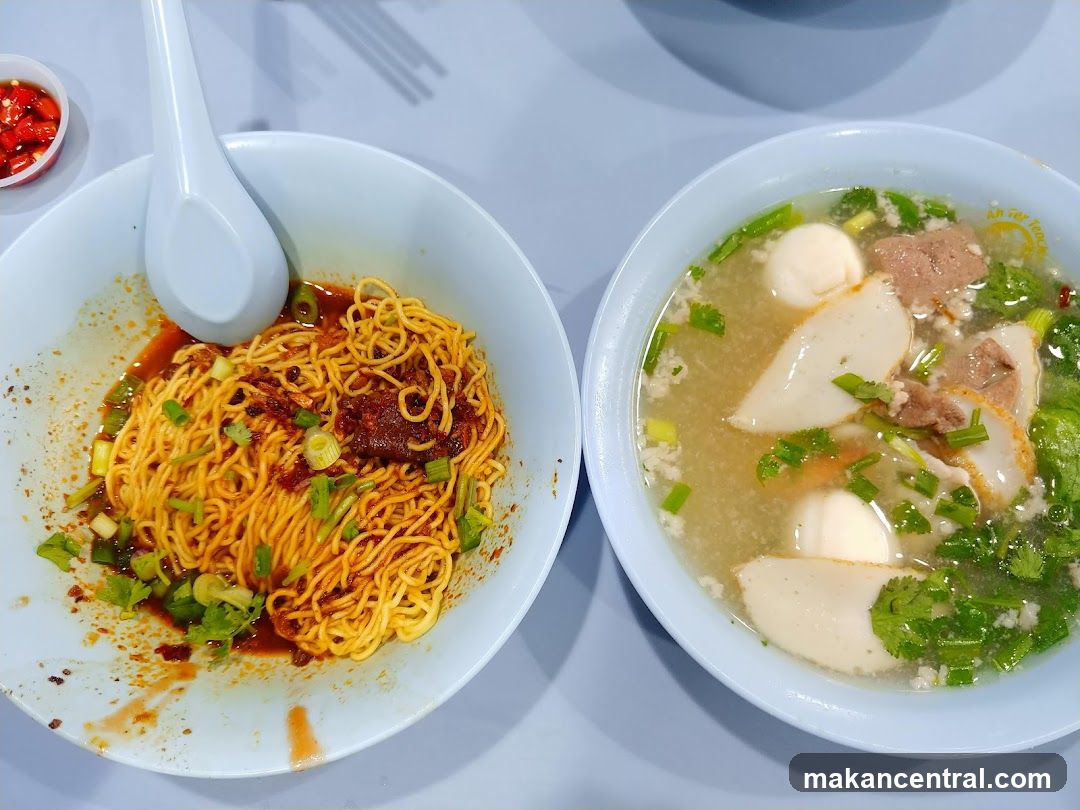 Two bowls of noodle dishes on a table