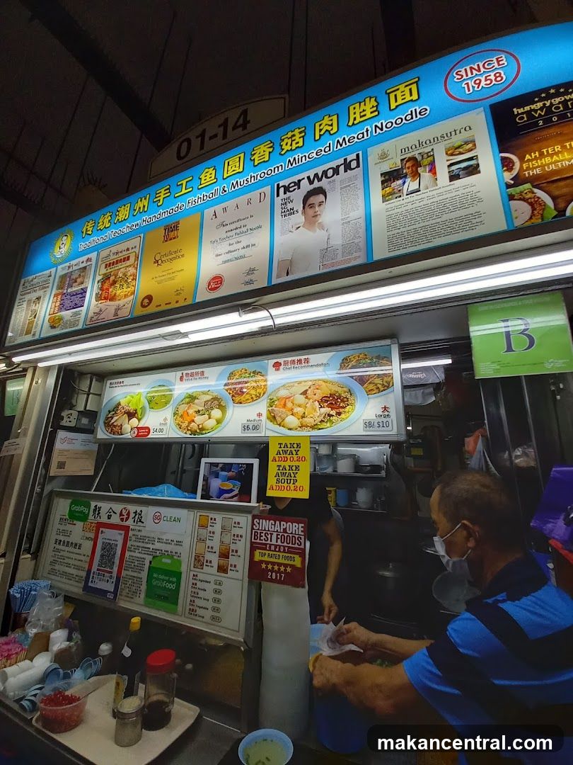 Food stall with signage and staff