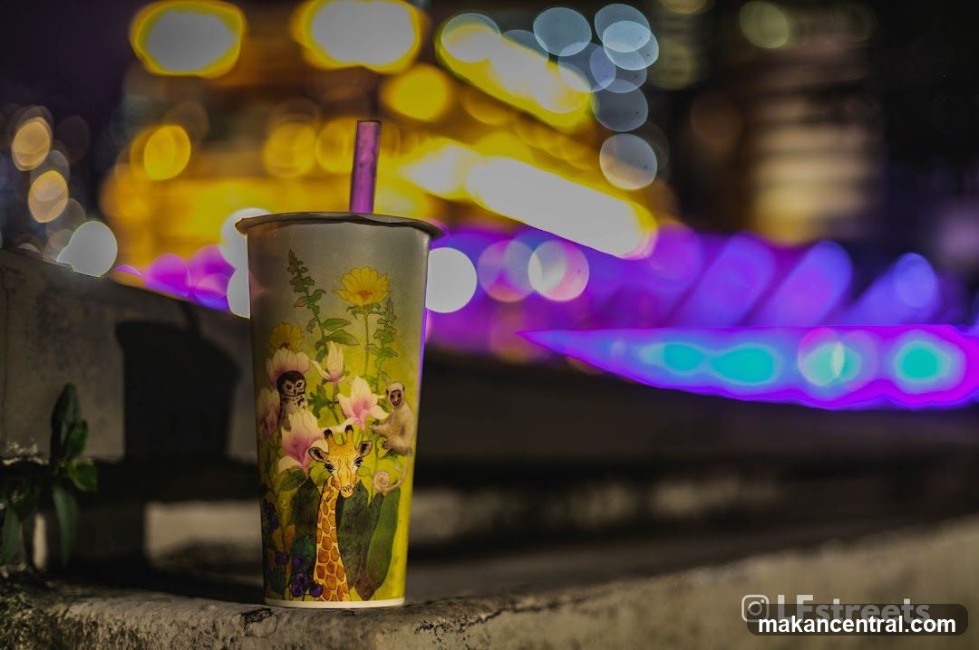 Nighttime Urban Scene with Beverage Cup