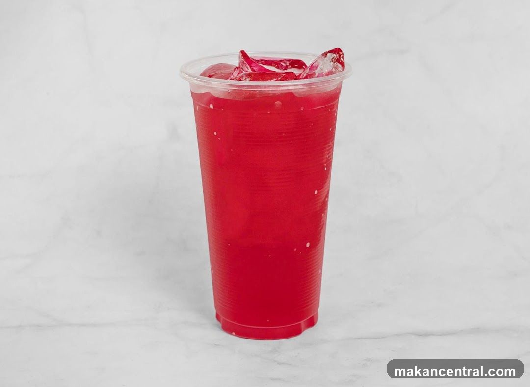 Red beverage in plastic cup