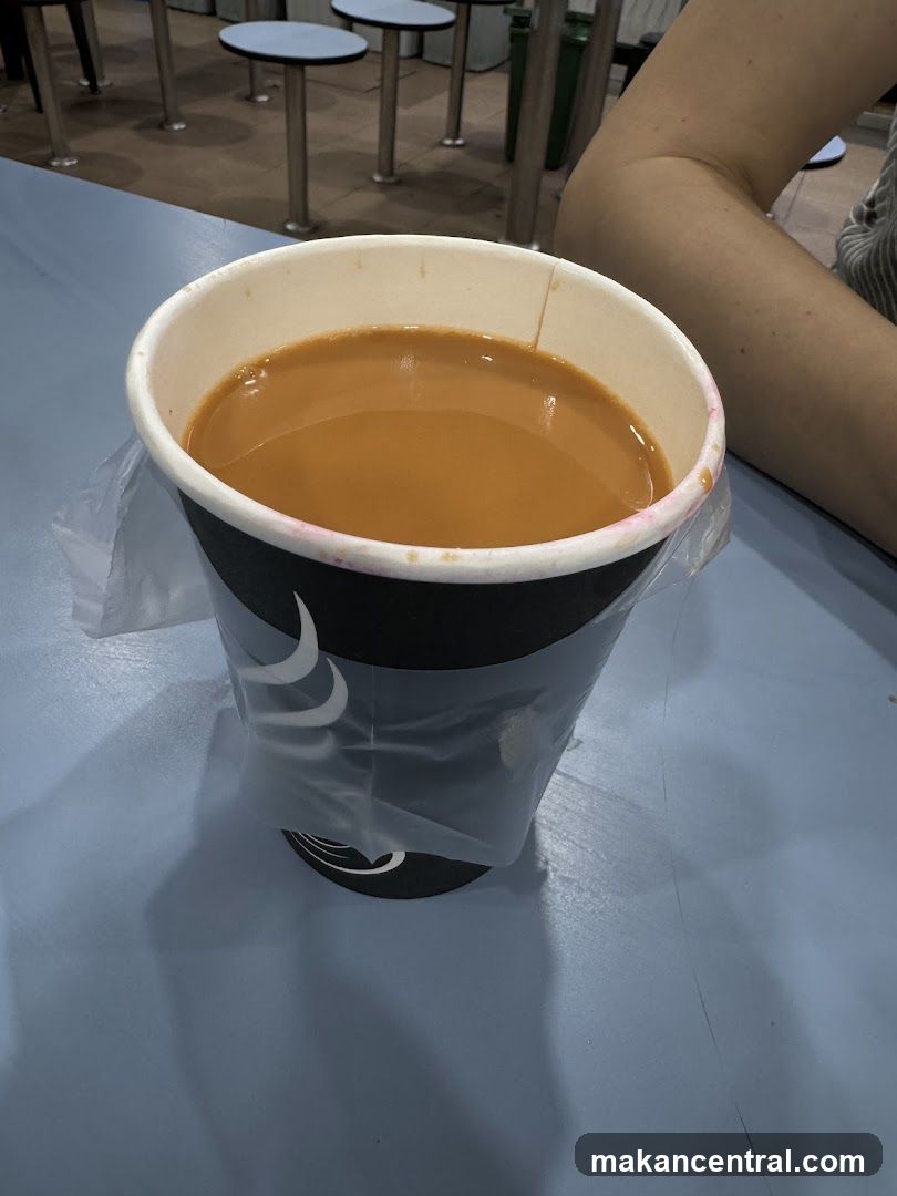 Cup of beverage on table