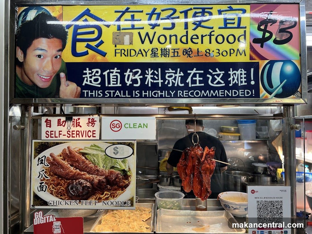 Food stall interior with signage and cooking display
