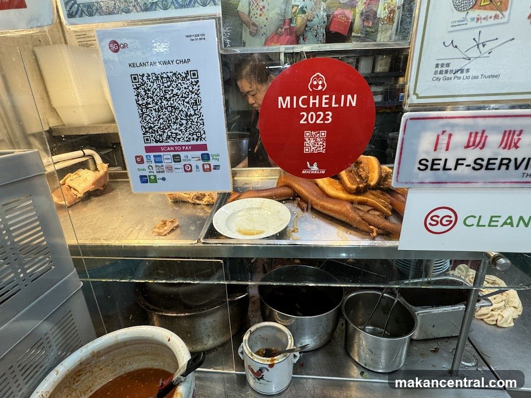 Food stall interior with Michelin signage