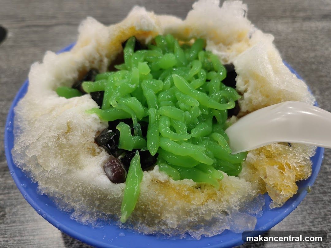 Ice dessert with green noodles and shaved ice