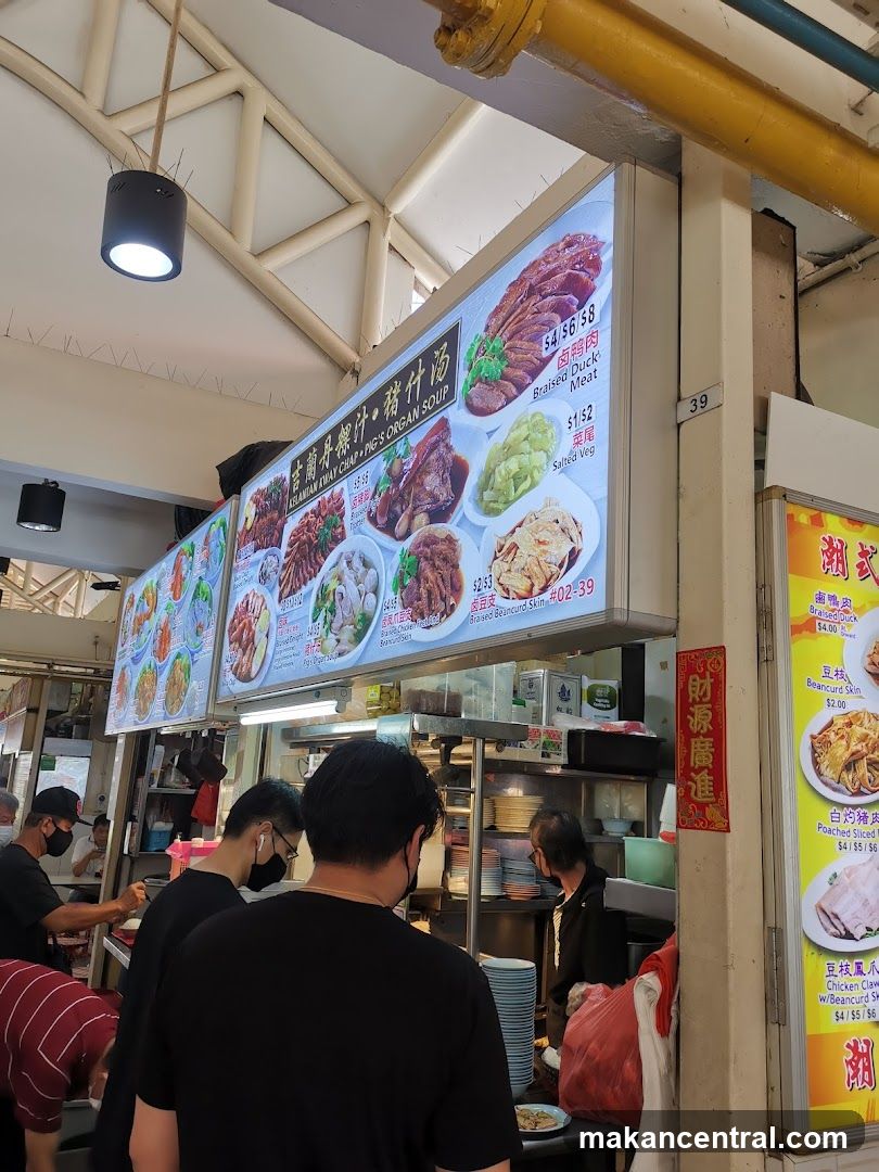 Food stall interior with customers and staff