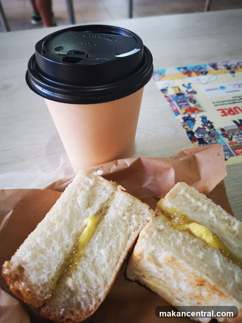 Coffee and Sandwich on Table