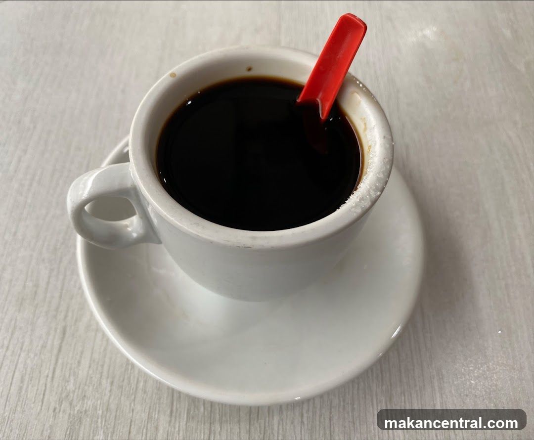 Coffee Cup with Red Spoon