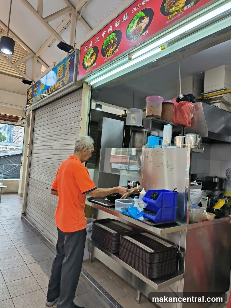 Food stall interior with staff preparing food