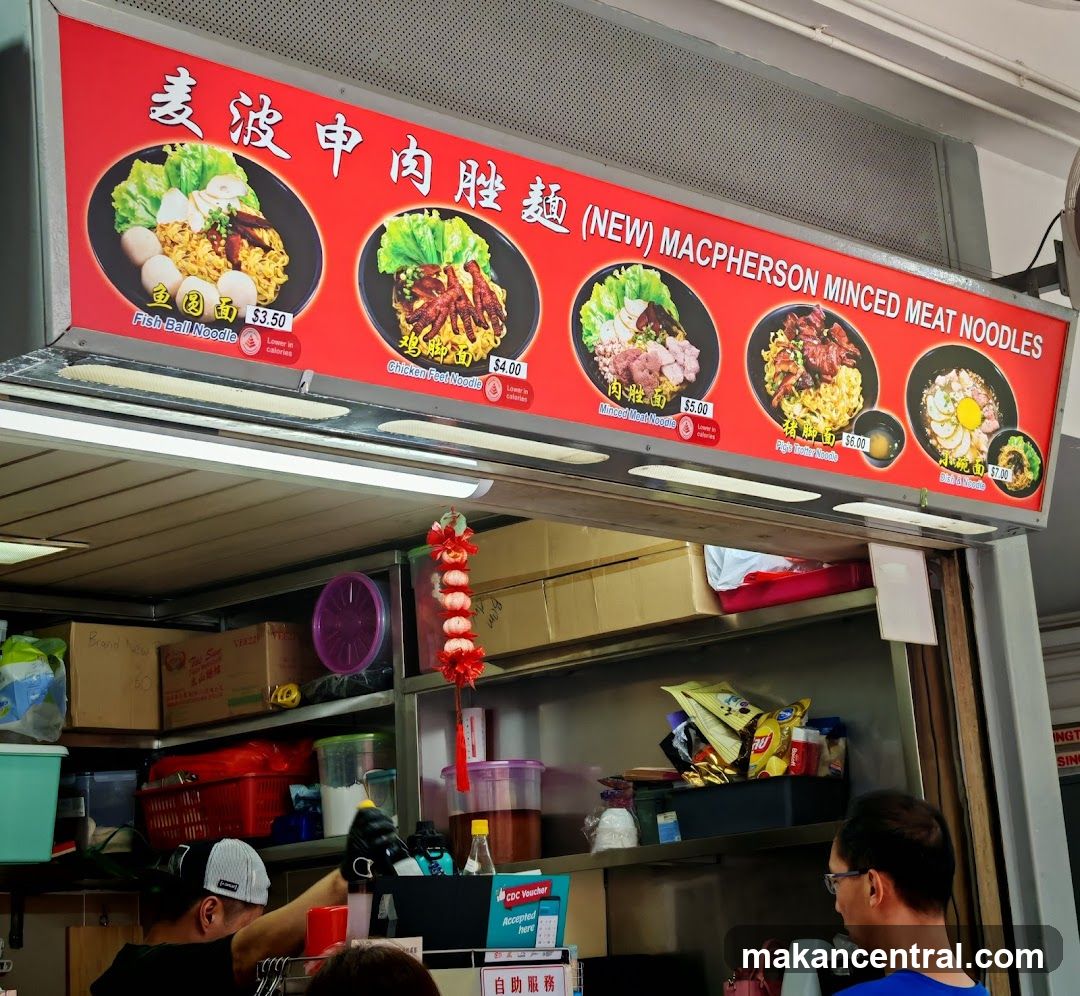Food stall interior with red signage