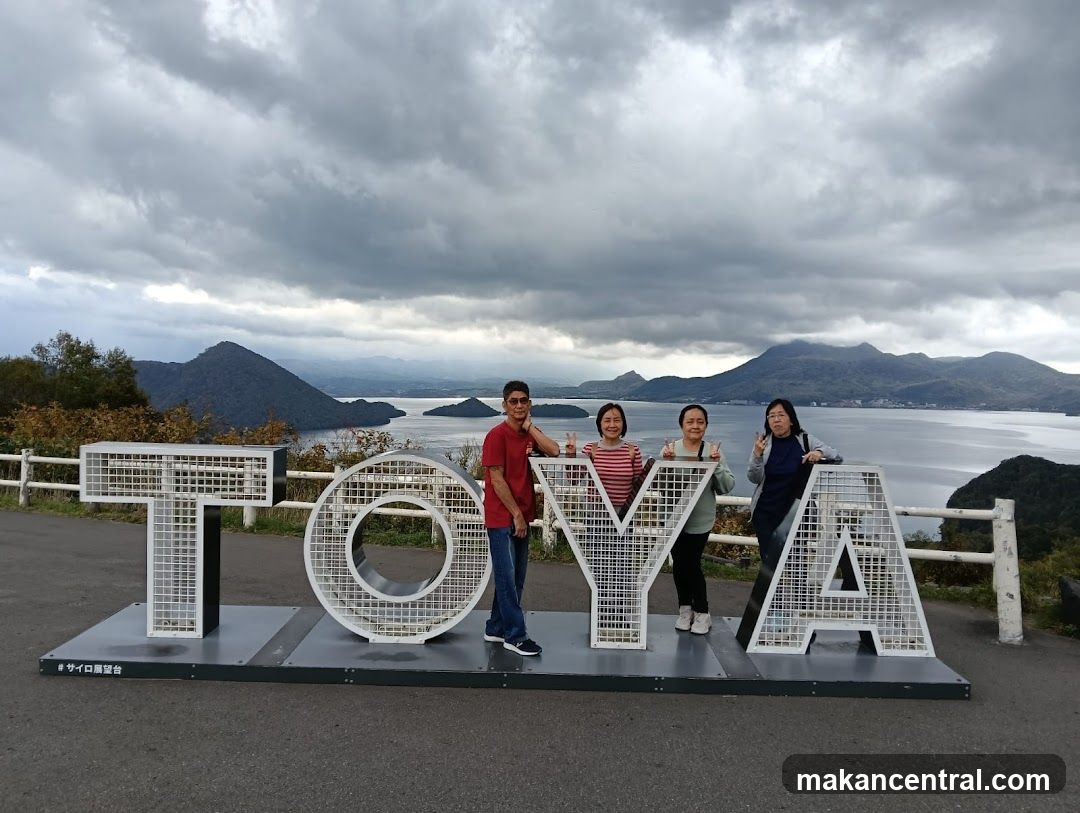 Group photo at TOYA sign