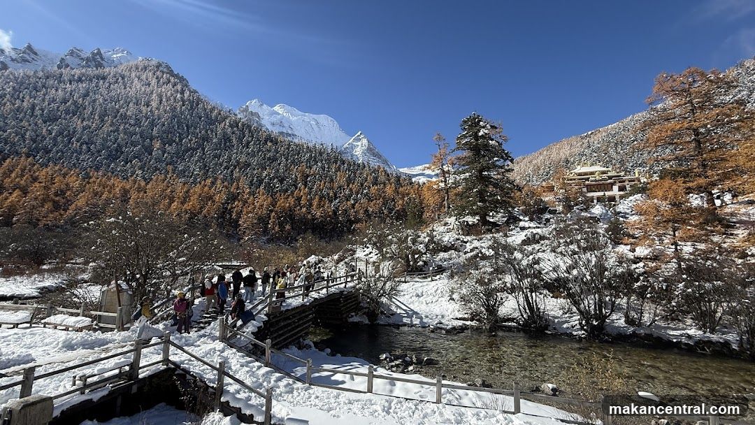 Snowy Mountain Landscape with Tourists