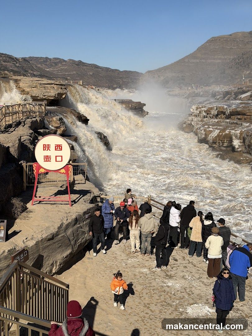 Tourists at a waterfall site