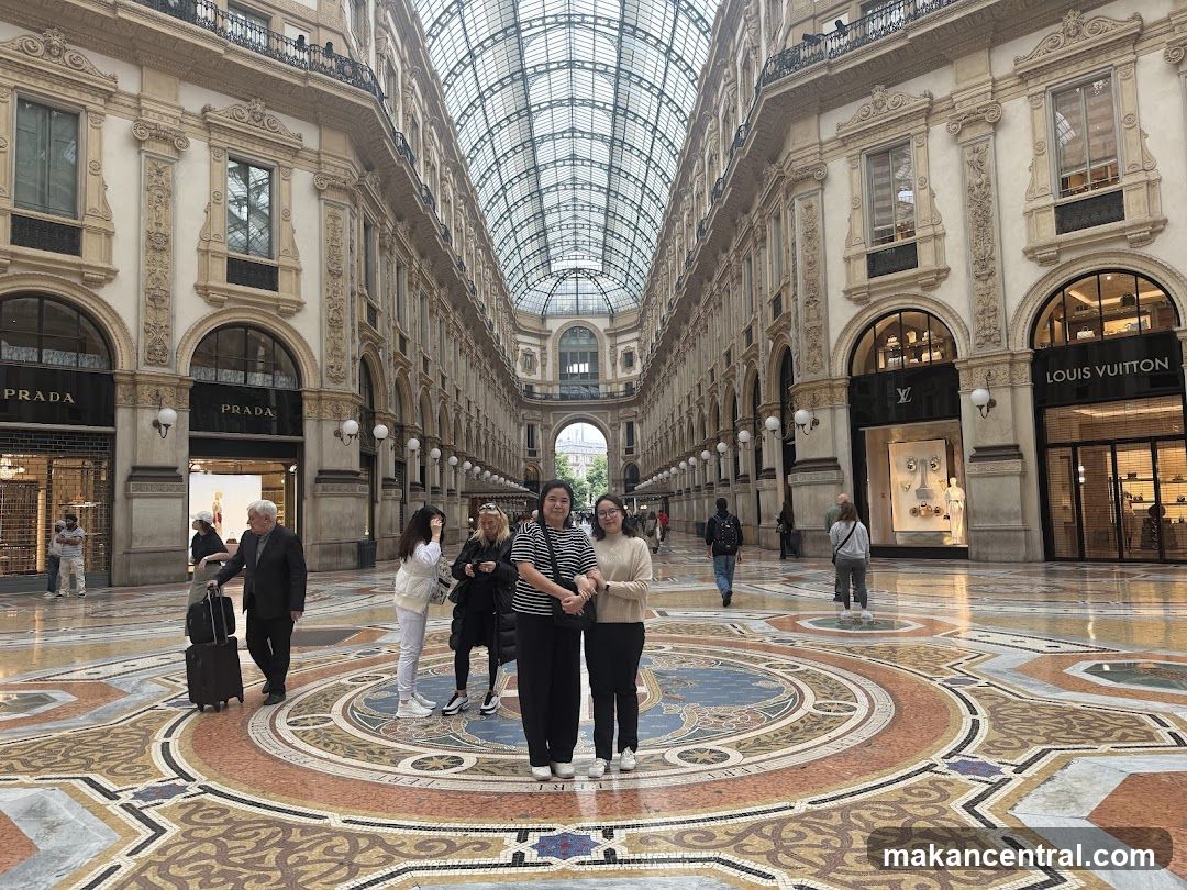 Group photo inside a luxury shopping arcade