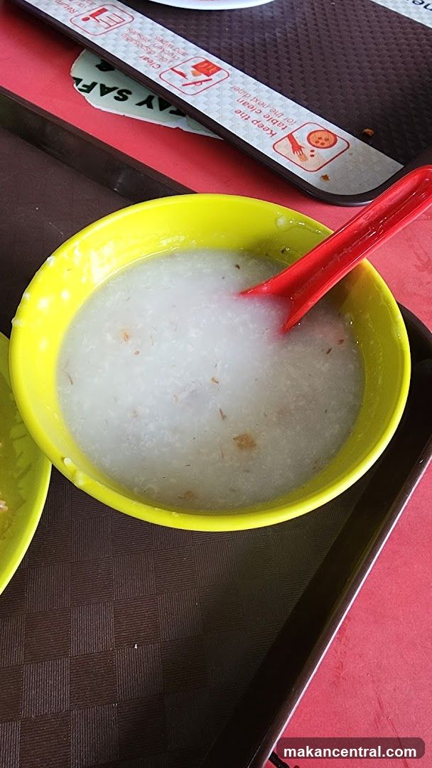 Food served in a yellow bowl with red spoon