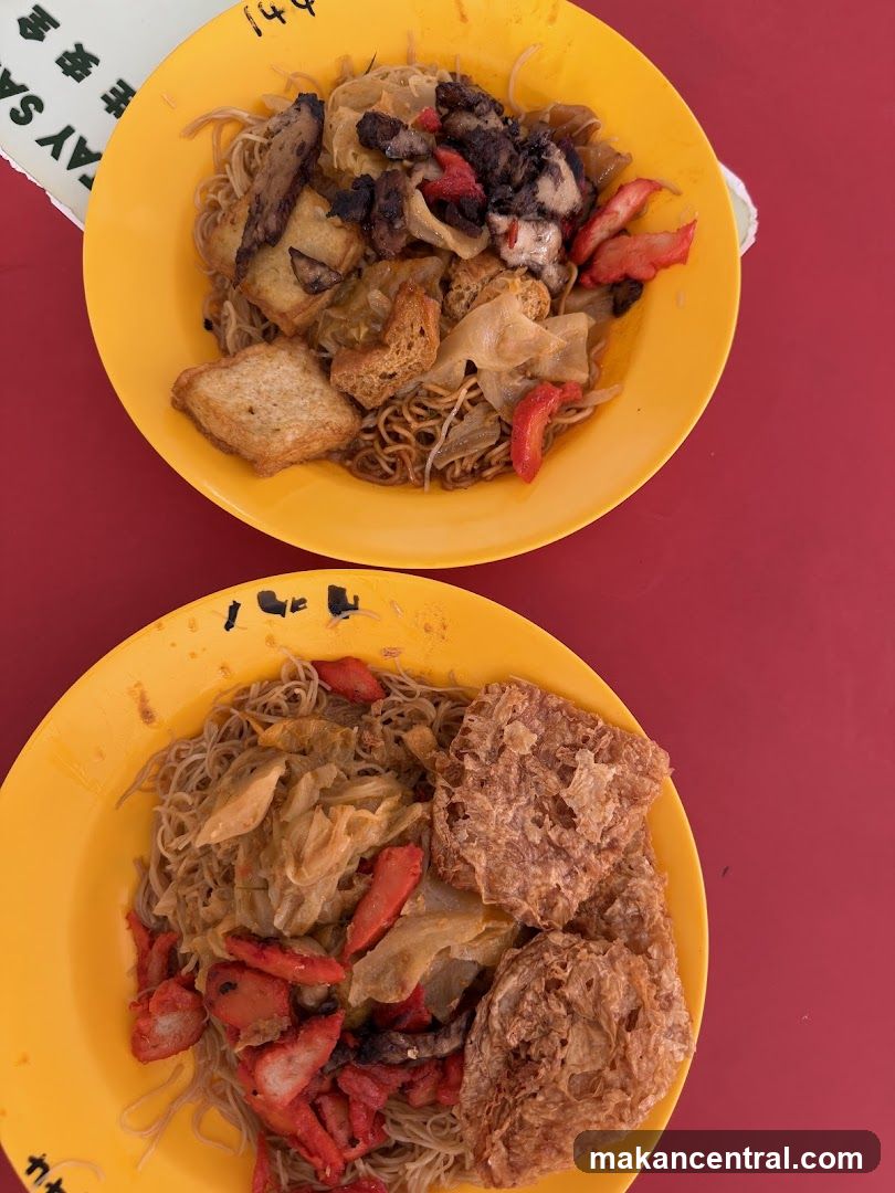 Noodles with toppings served in yellow bowls