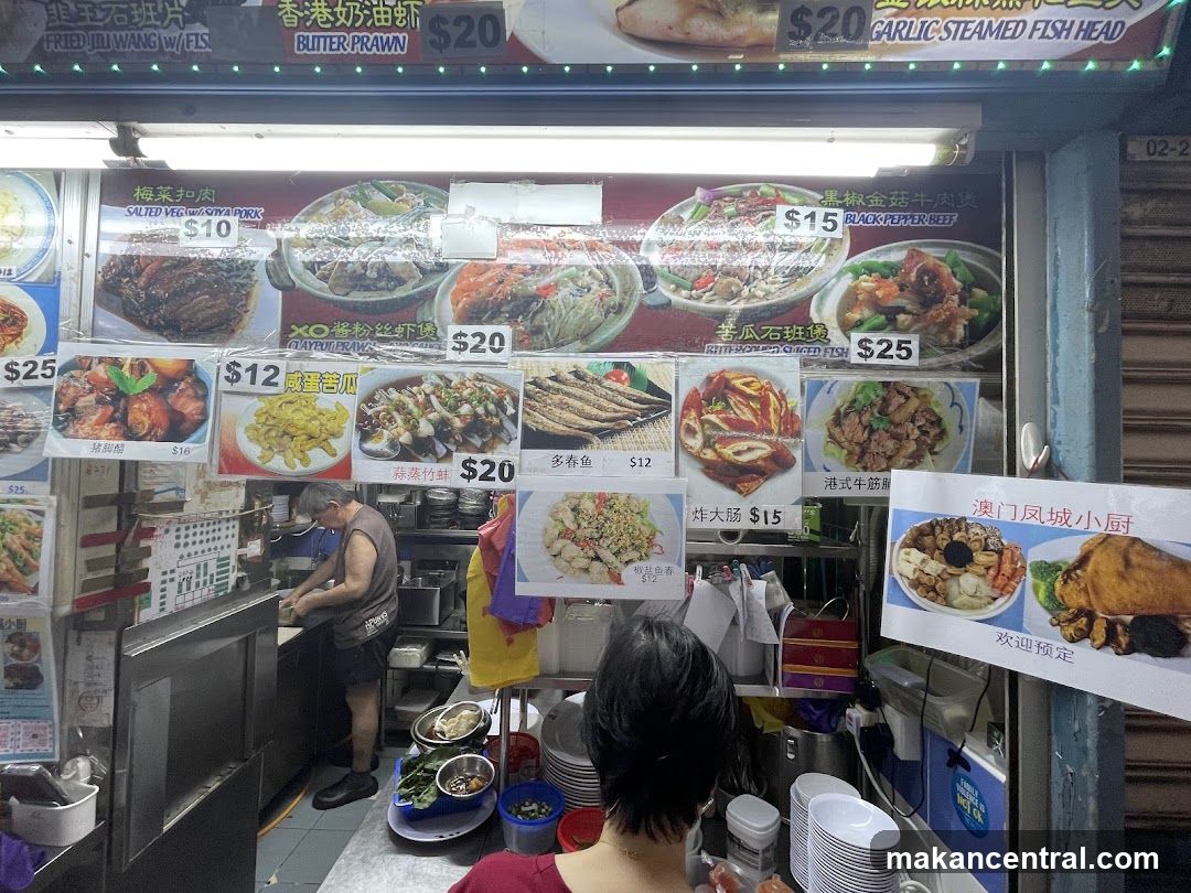 Food stall interior with chef preparing food