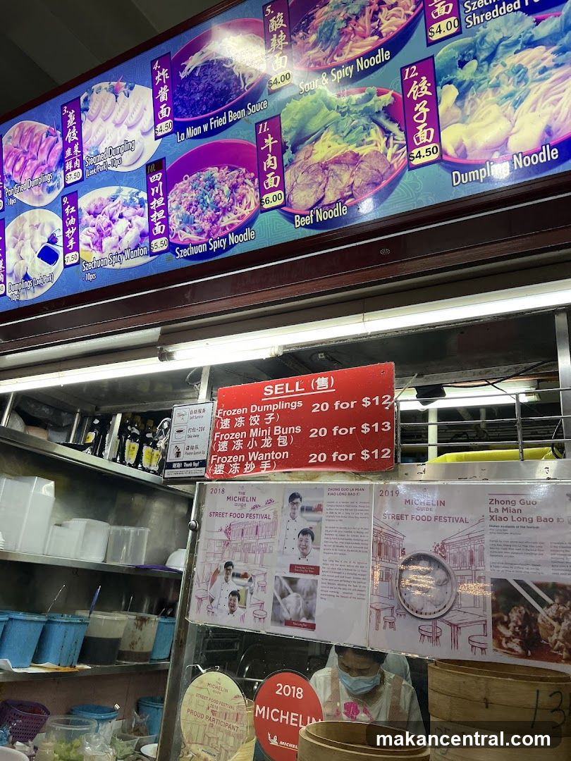 Food stall interior with menu board and promotional materials