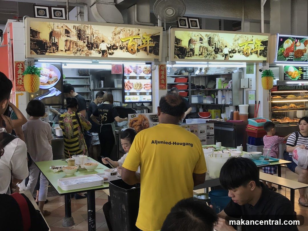 Food stall interior with customers and staff