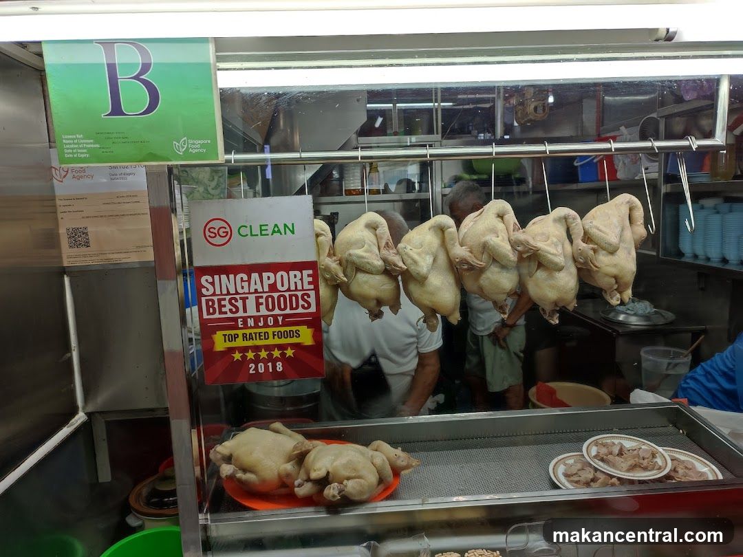 Food stall interior with hanging chickens