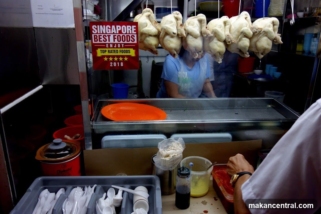 Food stall interior with hanging chickens