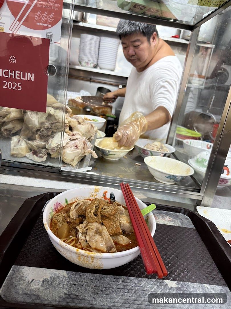Food stall interior with chef preparing dish