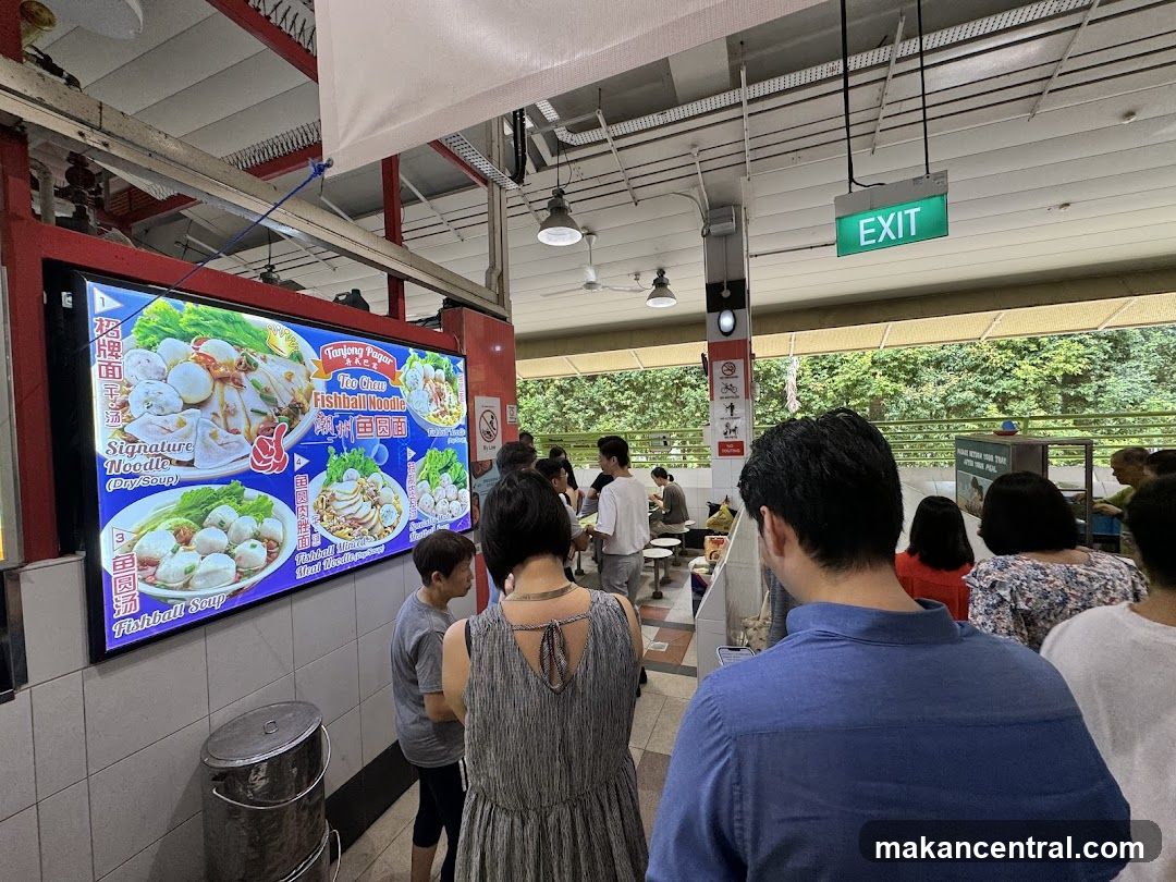 Interior of a food stall with customers waiting