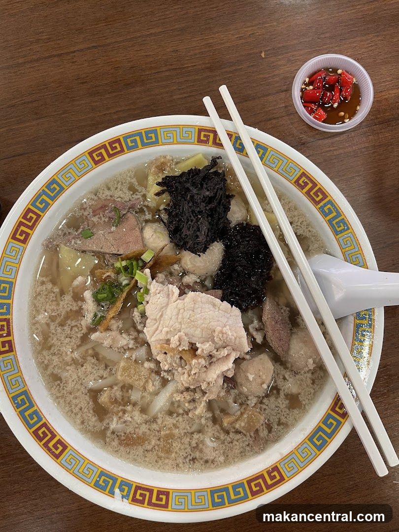 Bowl of Soup with Side Sauce