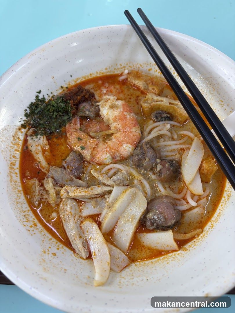 Laksa bowl with chopsticks
